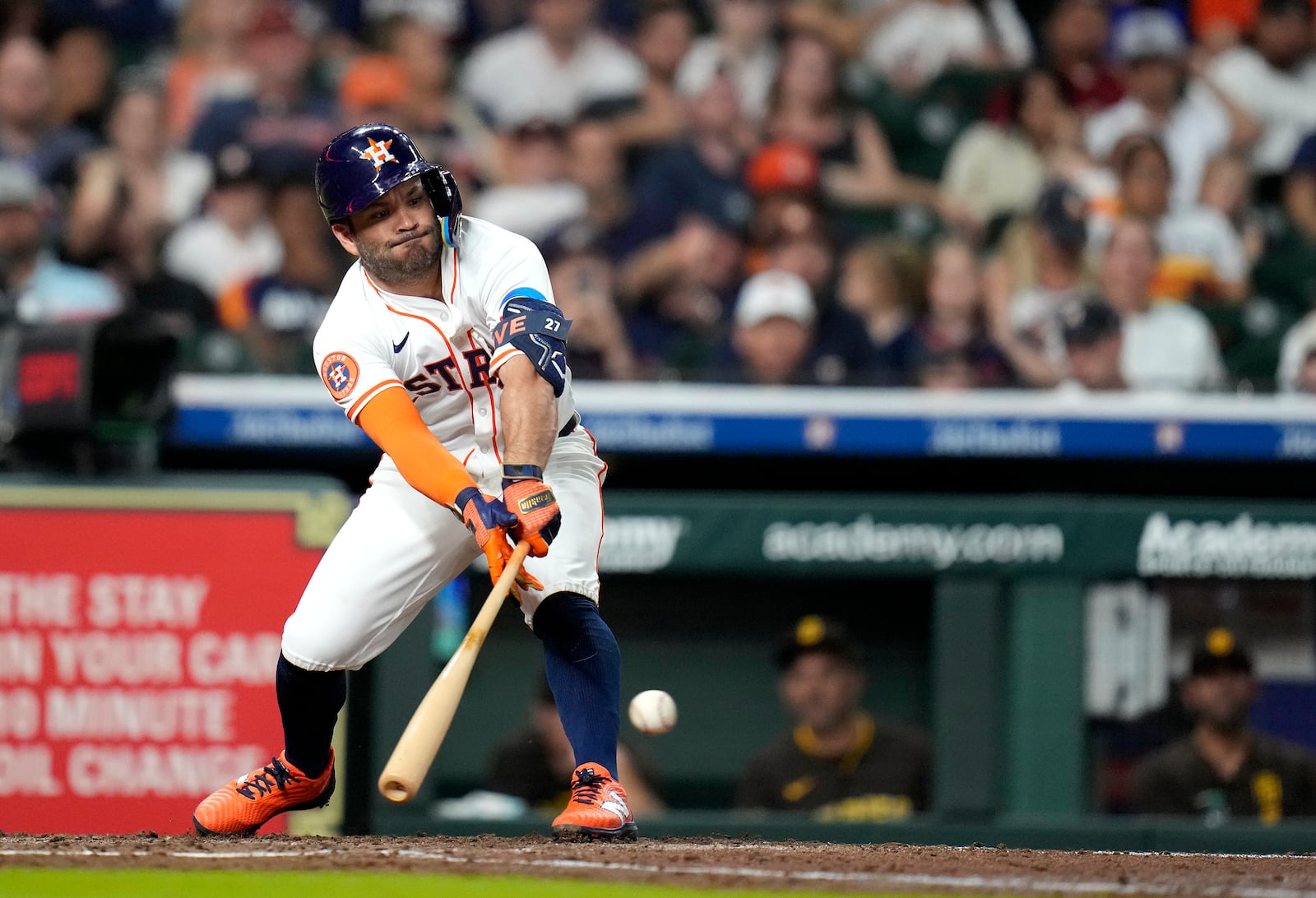 Houston Astros designated hitter Jose Altuve hits a single against San Diego Padres starting pitcher Dylan Cease during the third inning of a baseball game Sunday, April 20, 2025, in Houston. (AP Photo/Karen Warren)