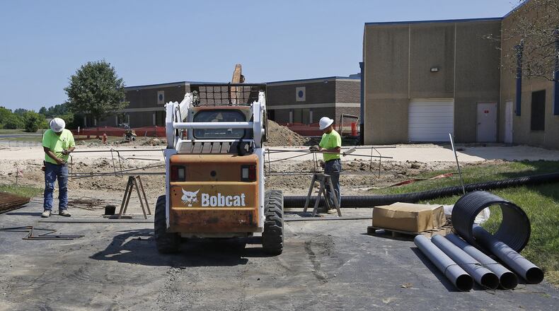 Contractors from WILCON, Corp. are working on an expansion of the fitness area at the Huber Heights YMCA. Workers on Friday were constructing rebar for the building foundation footers. TY GREENLEES / STAFF