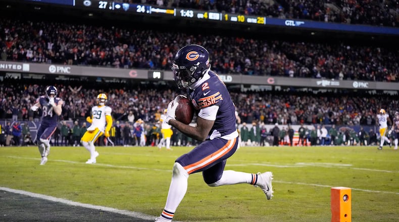 Chicago Bears' DJ Moore catches a touchdown pass during the second half of an NFL wild-card playoff football game against the Green Bay Packers Saturday, Jan. 10, 2026, in Chicago. (AP Photo/Nam Huh)