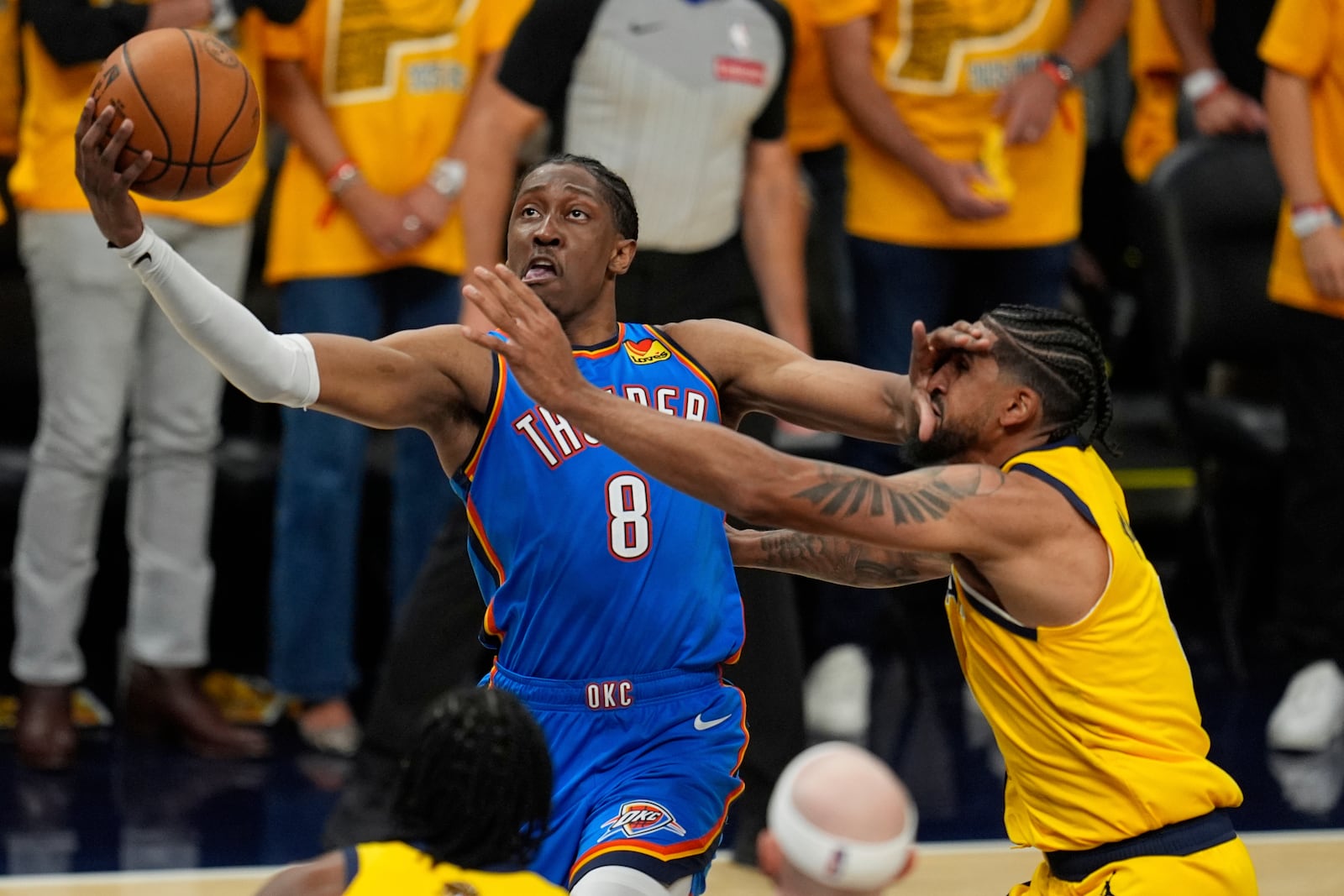 Oklahoma City Thunder forward Jalen Williams (8) shoots around Indiana Pacers guard Tyrese Haliburton during the first half of Game 4 of the NBA Finals basketball series, Friday, June 13, 2025, in Indianapolis. (AP Photo/Abbie Parr)