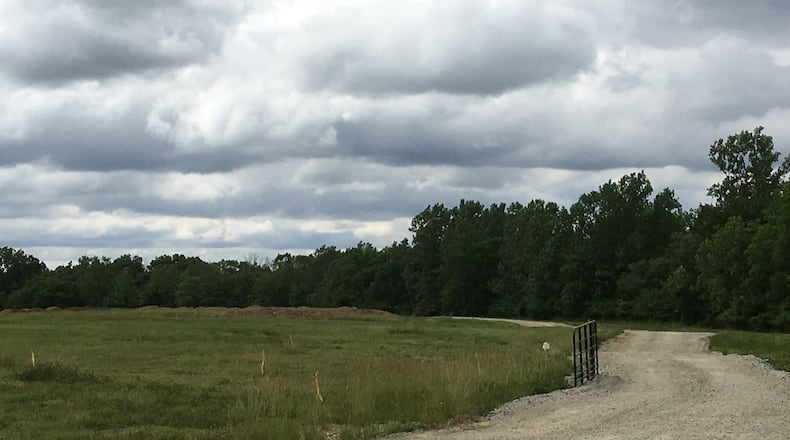 A boy rides on contours being added to a park in Burlington, Ky.