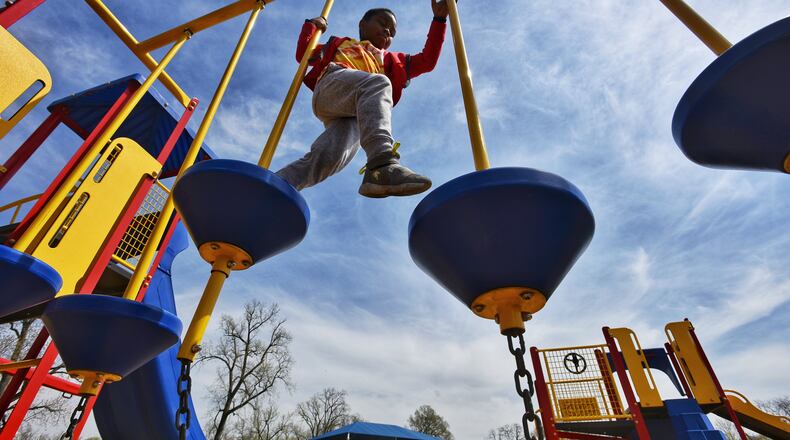 Elisha Butler, 7, plays on the playground at Smith Park Wednesday, April 7, 2021 in Middletown. NICK GRAHAM / STAFF