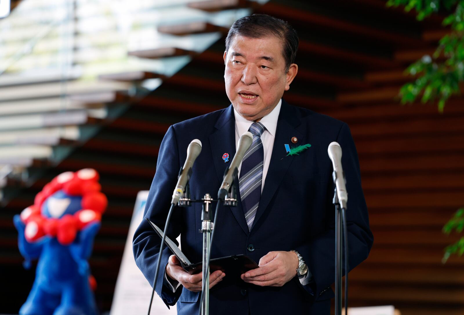 Japanese Prime Minister Shigeru Ishiba speaks to reporters reacting after a Japanese negotiator held ministerial talks at the White House regarding U.S. tariffs, at the prime minister's office in Tokyo, Japan, Thursday, April 17, 2025. (Franck Robichon/Pool Photo via AP)