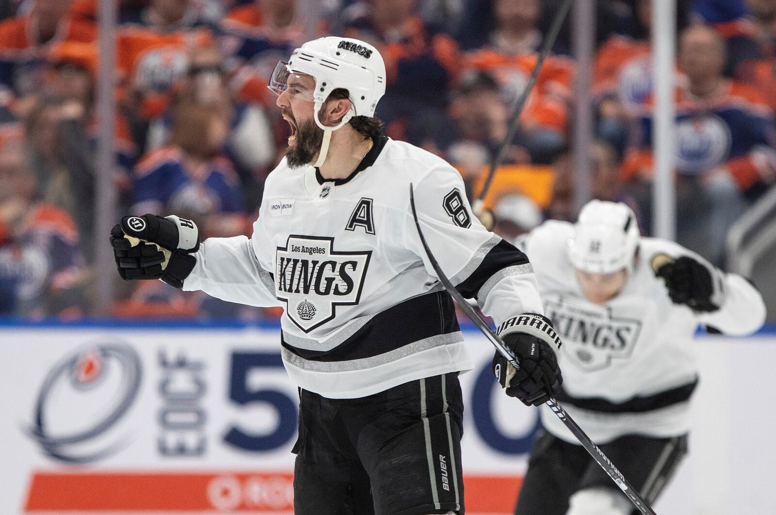 Los Angeles Kings' Drew Doughty (8) celebrates a goal against the Edmonton Oilers during the second period of an NHL hockey playoff game in Edmonton, Alberta, Friday, April 25, 2025. (Jason Franson/The Canadian Press via AP)