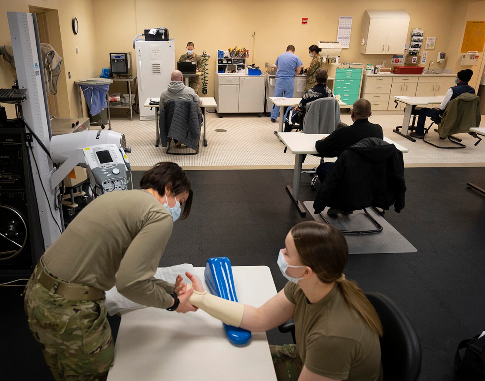 Capt. Emily Philips, 88th Operational Medical Readiness Squadron occupational therapist, demonstrates splinting a hand Jan. 25 on Airman 1st Class Leah Fitzke in Wright-Patterson Medical Center. U.S. AIR FORCE PHOTO/R.J. ORIEZ