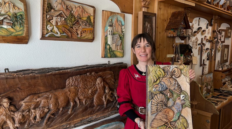 Jasmine Feuchter poses for a photo in a traditional craft shop in San Vigilio di Marebbe, northern Italy, Monday, Jan. 26, 2026. (AP Photo/Nicole Winfield)
