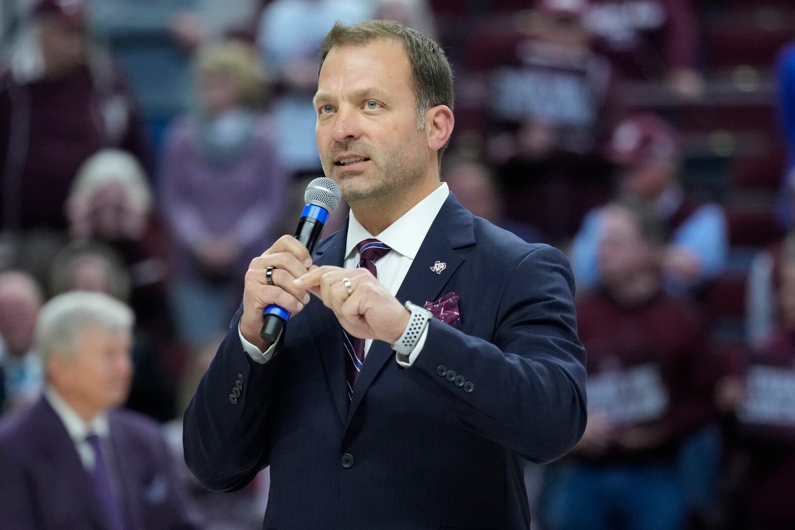 FILE - Texas A&M athletic director Ross Bjork speaks to the crowd at Reed Arena during a ceremony for Texas A&M head coach Gary Blair after an NCAA college basketball game Feb. 24, 2022, in College Station, Texas. (AP Photo/Sam Craft, File)