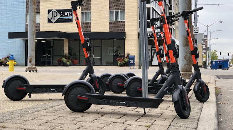 Spin scooters in downtown Dayton. CORNELIUS FROLIK / STAFF