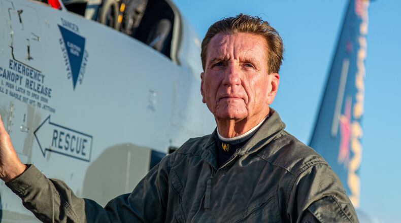 Larry Connor alongside F-5 fighter jet he has flown. CONTRIBUTED