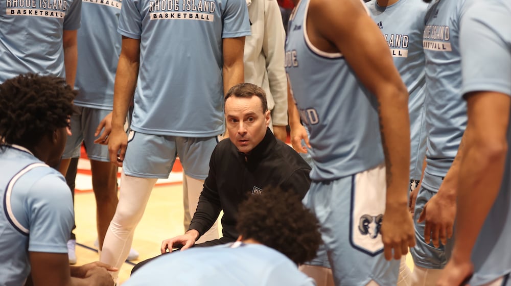 Rhode Island's Archie Miller huddles with his team before a game against Dayton on Saturday, Jan. 20, 2024, at UD Arena. David Jablonski/Staff