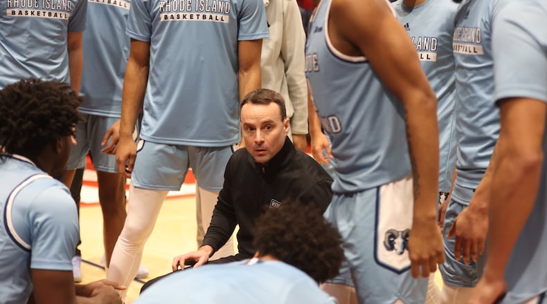 Rhode Island's Archie Miller huddles with his team before a game against Dayton on Saturday, Jan. 20, 2024, at UD Arena. David Jablonski/Staff