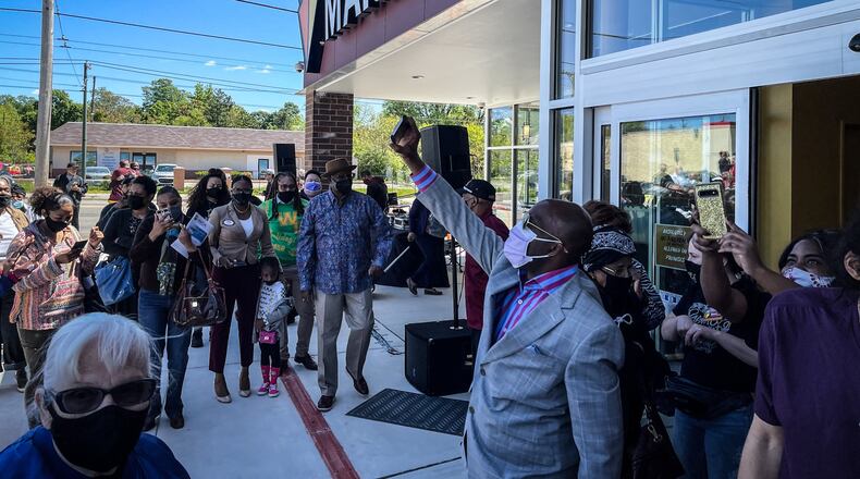 More than 175 people applauded when the Gem City Market opened for business on Wednesday, a sign that it’s more than just a grocery store ― it’s a community-led movement, an oasis in the middle of a major food desert and a major investment in an area that has been underserved. JIM NOELKER/STAFF