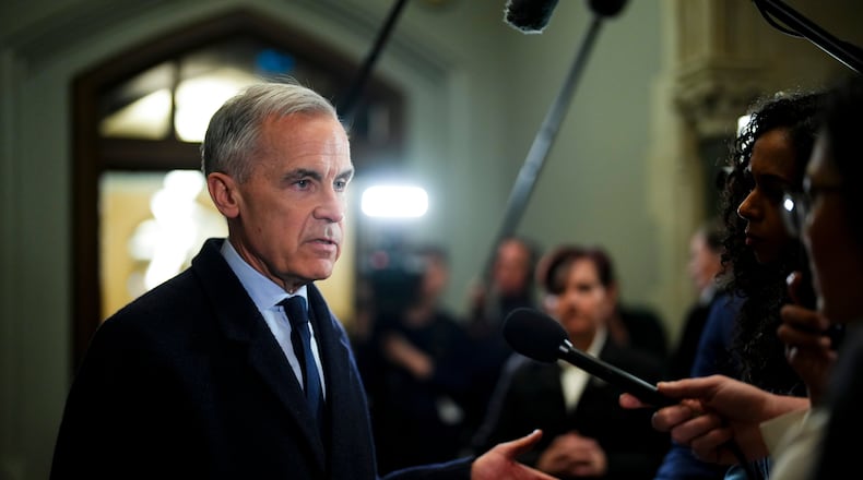 Prime Minister Mark Carney arrives to Parliament Hill in Ottawa on Wednesday, March 25, 2026. (Sean Kilpatrick /The Canadian Press via AP)