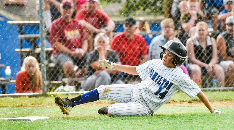 Hamilton West Side’s Nick Brosius slides safely into home plate during Tuesday night’s 10-0 victory over Hamilton-Fairfield in the winners’ bracket final of the District 9 tournament at the West Side complex. NICK GRAHAM/STAFF