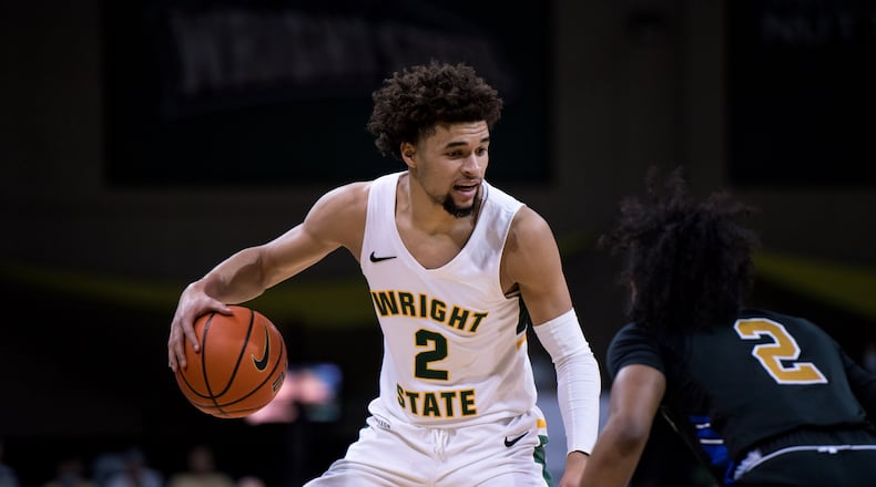 Wright State's Tanner Holden is defended by Purdue Fort Wayne's Damian Chong Qui during their game at the Nutter Center on Jan. 30, 2022. Joseph Craven/Wright State Athletics