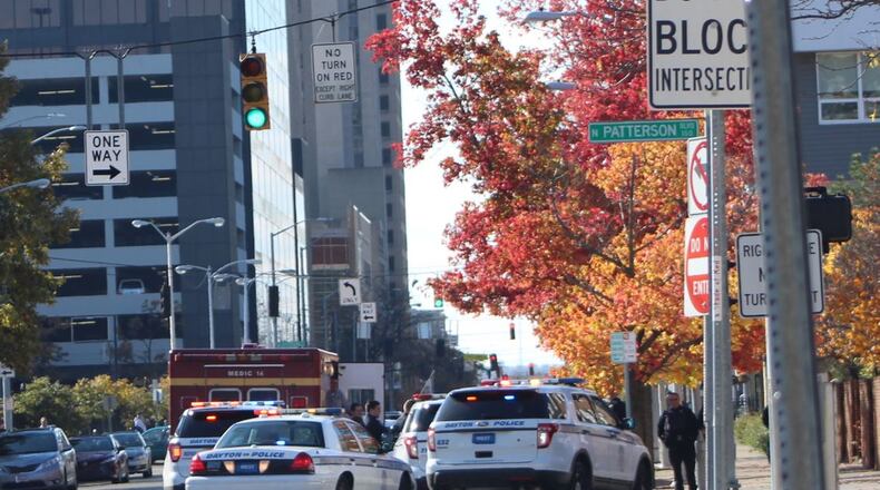 Dayton police respond to a situation on East Second Street in downtown Dayton. CORNELIUS FROLIK / STAFF