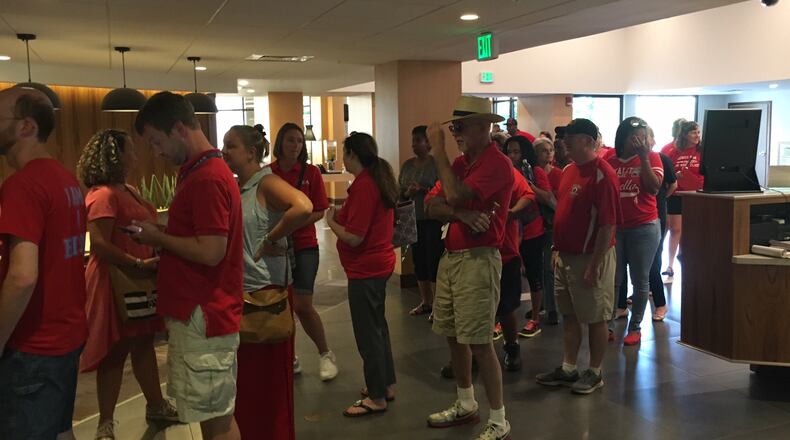 Dayton Education Association members file into the Marriott Hotel on Thursday to vote on their new two-year contract. JEREMY P. KELLEY / STAFF