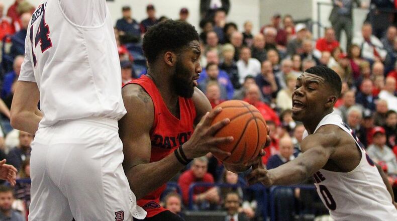 Dayton’s Josh Cunningham looks for a shot against Duquesne on Saturday, March 9, 2019, at the Palumbo Center in Pittsburgh. David Jablonski/Staff