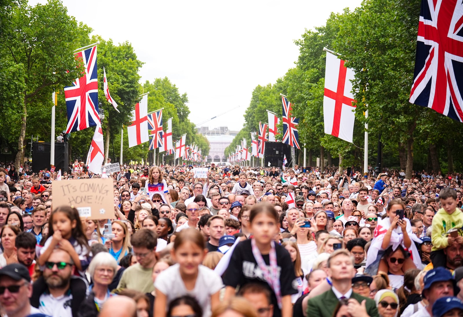 Fans gather during on the Mall during a Homecoming Victory Parade in London, Tuesday July 29, 2025, two days after England defended their European Championship crown as they beat Spain on penalties in the final of Euro 2025. (James Manning/PA via AP)
