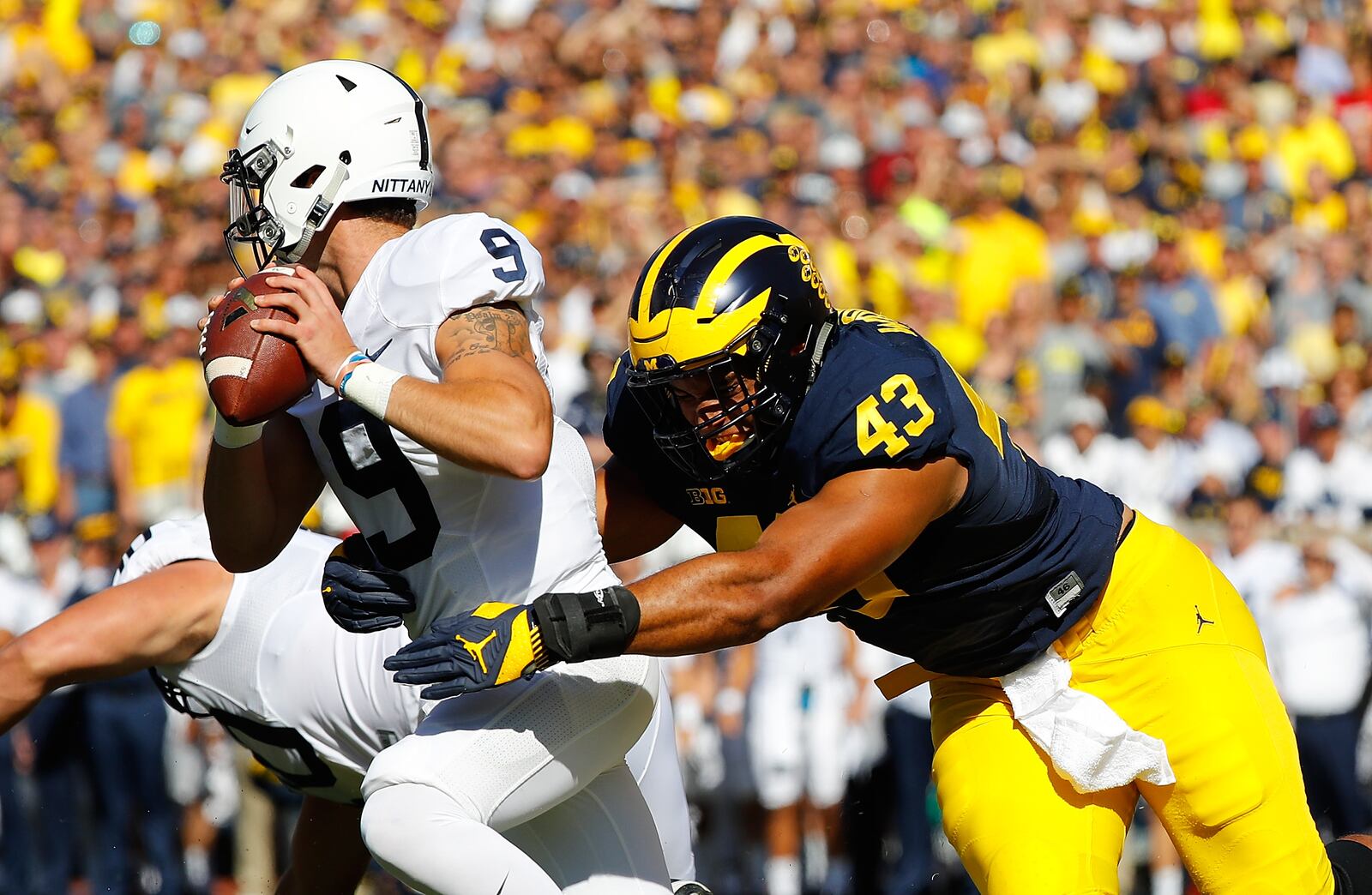 ANN ARBOR, MI - SEPTEMBER 24: Chris Wormley #43 of the Michigan Wolverines sacks quarterback Trace McSorley #9 of the Penn State Nittany Lions during the first quarter of the game at Michigan Stadium on September 24, 2016 in Ann Arbor, Michigan. (Photo by Leon Halip/Getty Images)