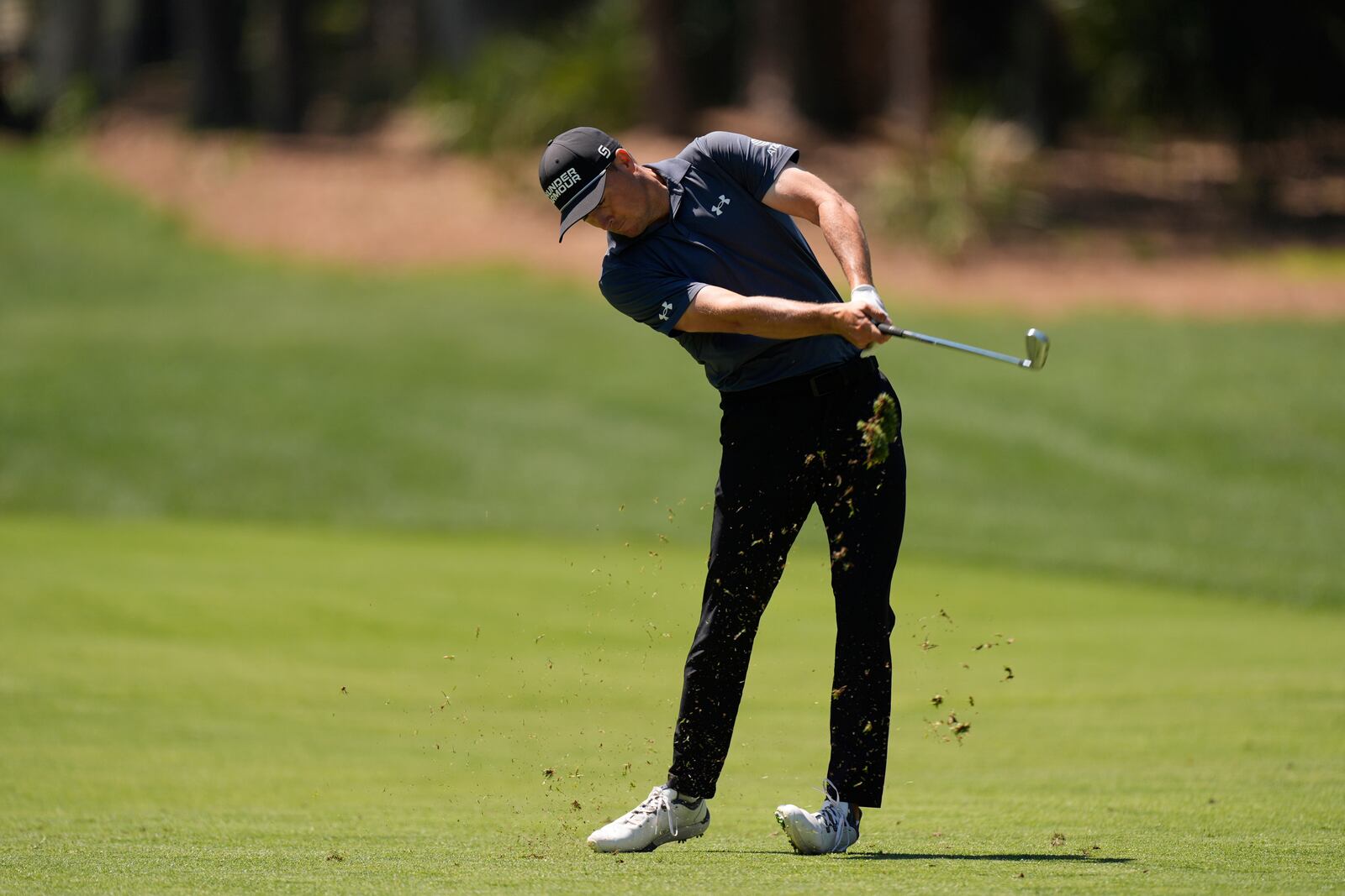 Jordan Spieth hits from the fairway on the eighth hole during the first round of the RBC Heritage golf tournament, Thursday, April 17, 2025, in Hilton Head Island, S.C. (AP Photo/Mike Stewart)