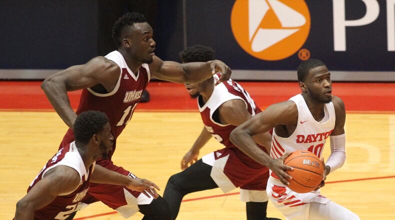 Dayton’s Jalen Crutcher drives to the basket against Massachusetts on Sunday, Jan. 13, 2019, at UD Arena. David Jablonski/Staff