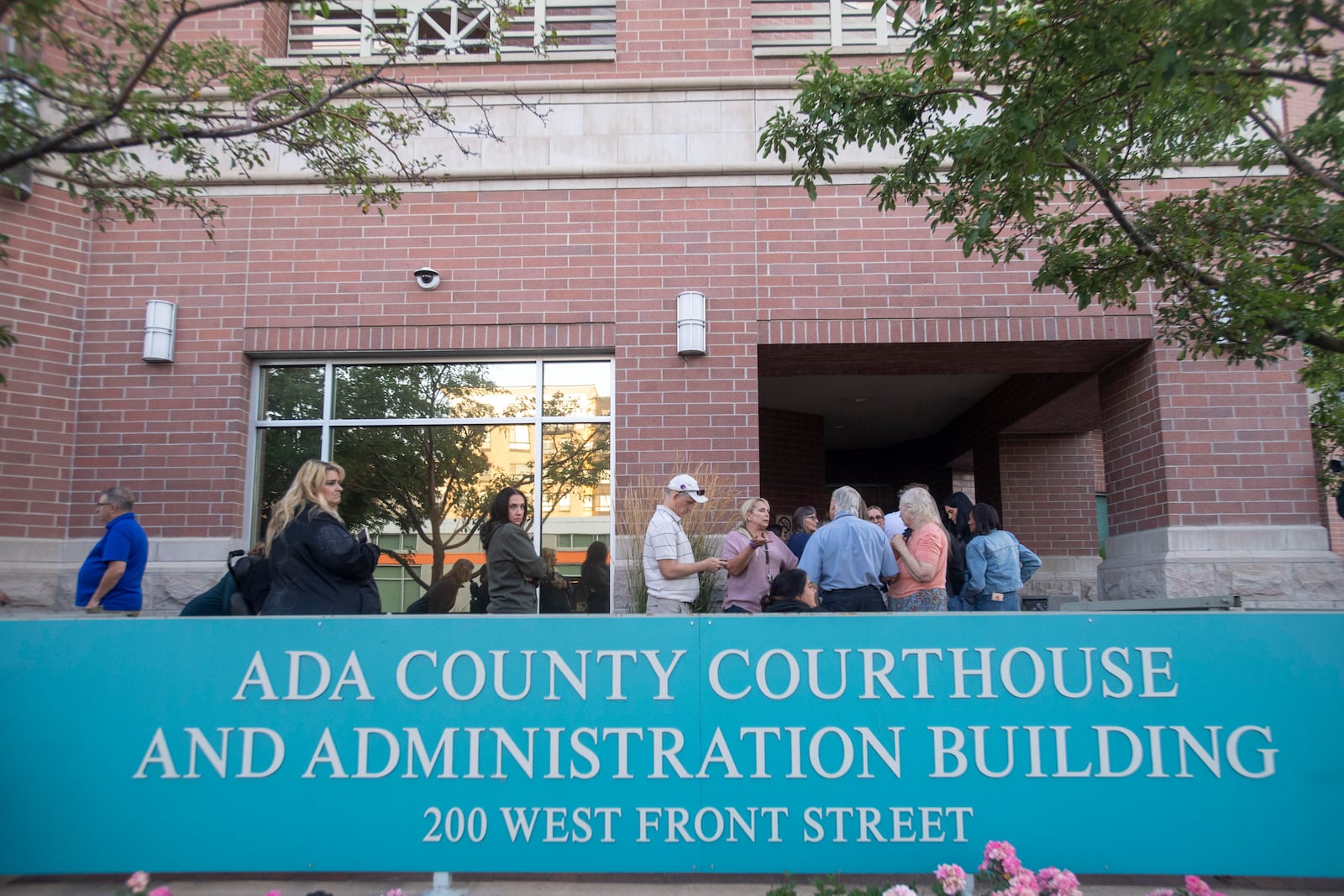 People wait in line outside the Ada County Courthouse for the Bryan Kohberger sentencing, Wednesday, July 23, 2025, in Boise, Idaho. (AP Photo/Drew Nash)