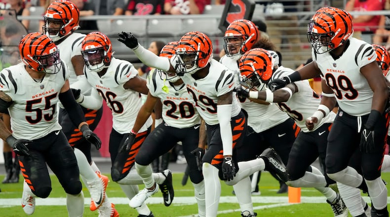 Cincinnati Bengals cornerback Cam Taylor-Britt (29) celebrates his interception for a touchdown against the Arizona Cardinals during the second half of an NFL football game, Sunday, Oct. 8, 2023, in Glendale, Ariz. (AP Photo/Rick Scuteri)