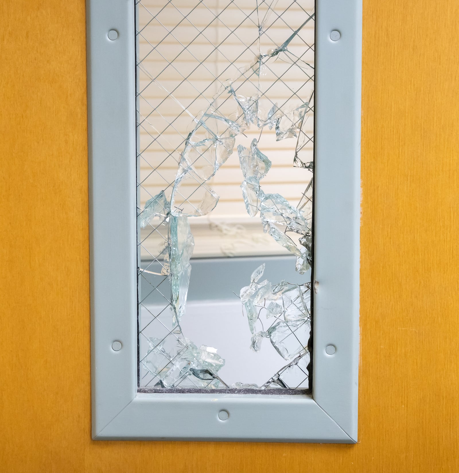 Security cameras filmed what appears to be a man in a heavy jacket breaking into and stealing money from a donation box in Ahiska Turkish Community Center on East Fifth Street in Dayton on Tuesday night. A window was shattered and a cabinet was broken into in an office. BRYANT BILLING/STAFF