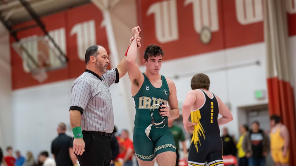 Catholic Central High School senior Brody Adamas has he arm raised by an official after winning a match at the Clark County Clash earlier this season at Wittenberg University. CONTRIBUTED PHOTO