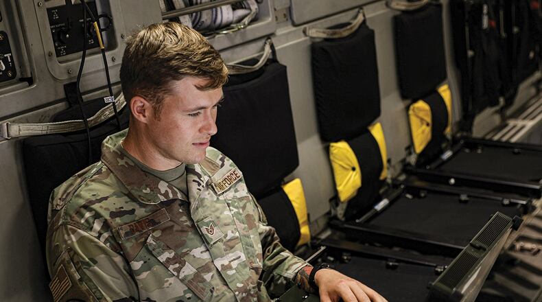 Staff Sgt. Ryan Davis, 445th Aircraft Maintenance Squadron avionics specialist, troubleshoots communications systems aboard a C-17 Globemaster III aircraft July 9 at Wright-Patterson Air Force Base. U.S. AIR FORCE PHOTO/STAFF SGT. ETHAN SPICKLER