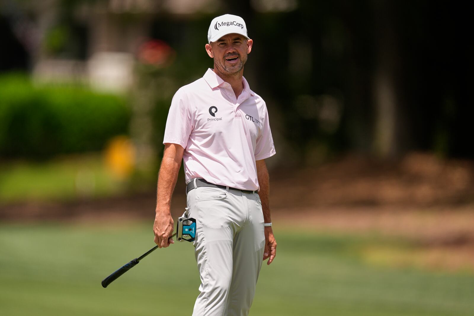 Brian Harman reacts after hitting a putt on the second hole during the final round of the RBC Heritage golf tournament, Sunday, April 20, 2025, in Hilton Head Island, S.C. (AP Photo/Mike Stewart)