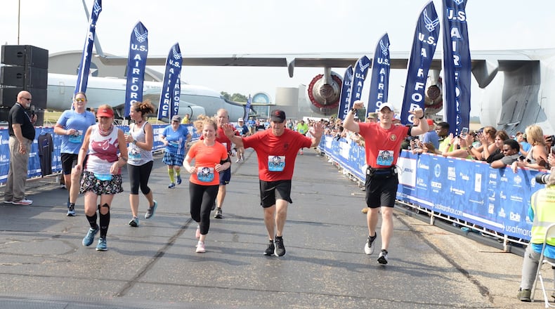 Gen. David L. Goldfein celebrates as he crosses the finish line at the 23rd Air Force Marathon at Wright-Patterson Air Force Base on Saturday. (U.S. Air Force photo by Wesley Farnsworth)