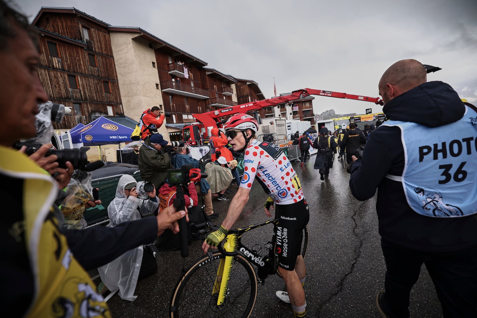 Denmark's Jonas Vingegaard, wearing the best climber's dotted jersey, catches his breath after the nineteenth stage of the Tour de France cycling race over 129.9 kilometers (80.7 miles) with start in Albertville and finish in La Plagne, France, Friday, July 25, 2025. (Anne-Christine Poujoulat/Pool Photo via AP)