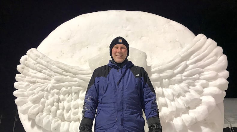 David Chesar took his background as an artist into his counseling career. Here he stands in front of a snow sculpture of his creation. CONTRIBUTED