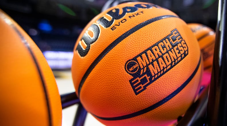 FILE - A basketball with a March Madness logo rests on a rack before a First Four game between Illinois and Mississippi State in the NCAA women's basketball tournament Wednesday, March 15, 2023, in South Bend, Ind.  (AP Photo/Michael Caterina, File)