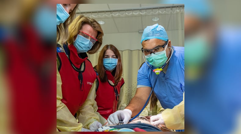 Upper Valley Medical Center emergency nurses Claire Wirrig, Lisa Brown, and Sue Hemmelgarn, with Dr. Pradeesh George, hospital trauma medical director.