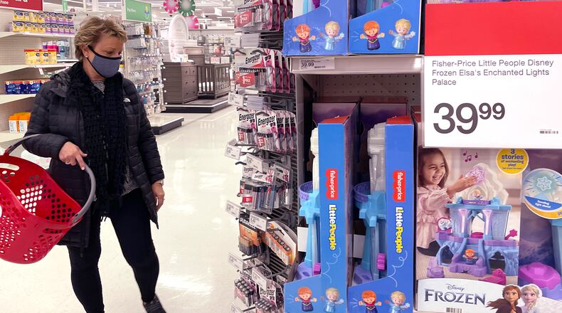 FILE - A shopper shops at a retail store in Glenview, Ill., Thursday, Dec. 16, 2021. (AP Photo/Nam Y. Huh, File)