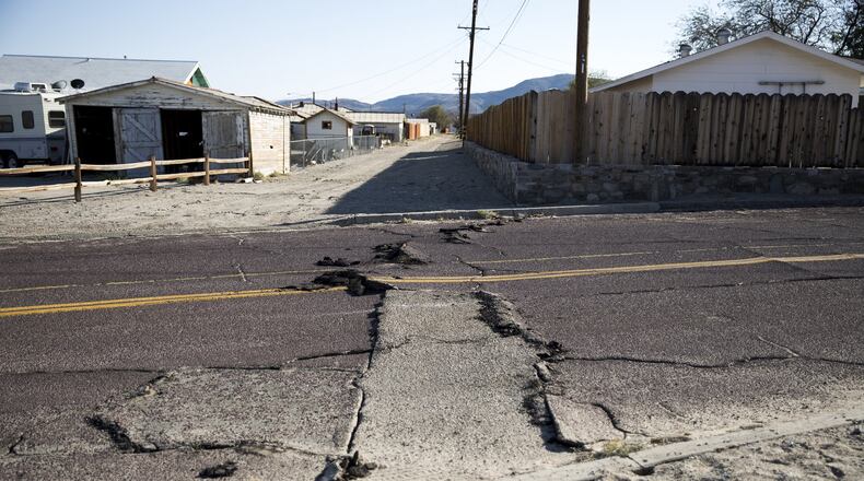 A cracked road following an earthquake in Trona, Calif., on Saturday, July 6, 2019. A 7.1-magnitude earthquake rattled Southern California on Friday night, one day after the strongest recorded quake there in 20 years struck - and seismologists warned that further episodes are expected. (Jenna Schoenefeld/The New York Times)