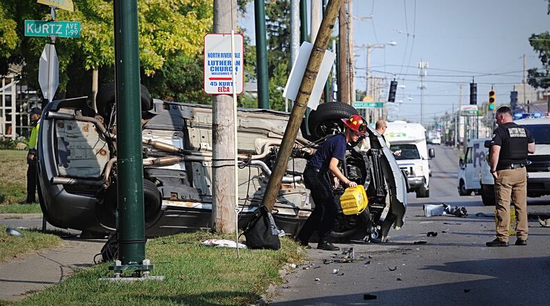A man was taken to the hospital following a two-vehicle crash at Main Street and Kurtz Avenue in Dayton on Wednesday, Sept. 23, 2020. STAFF PHOTO / MARSHALL GORBY