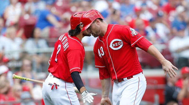 CINCINNATI, OH - JUNE 24:  Alex Blandino #2 of the Cincinnati Reds congratulates Scott Schebler #43 after scoring the go ahead run during the seventh inning of the game against the Chicago Cubs at Great American Ball Park on June 24, 2018 in Cincinnati, Ohio. Cincinnati defeated Chicago 8-6. (Photo by Kirk Irwin/Getty Images)