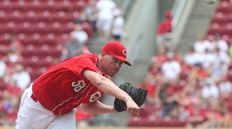 Reds starter Dan Straily pitches against the Brewers on Sunday, July 17, 2016, at Great American Ball Park in Cincinnati. David Jablonski/Staff