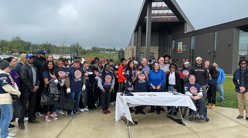 Organizers and volunteers meet for the first day of a two-day cleanup in Dayton's Westwood neighborhood.
