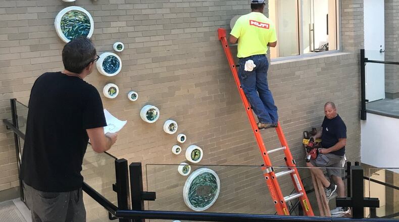 This artwork was created together by disabled artists at InsideOut and employees of the Kirsch CPA Group for its new building in Hamilton.