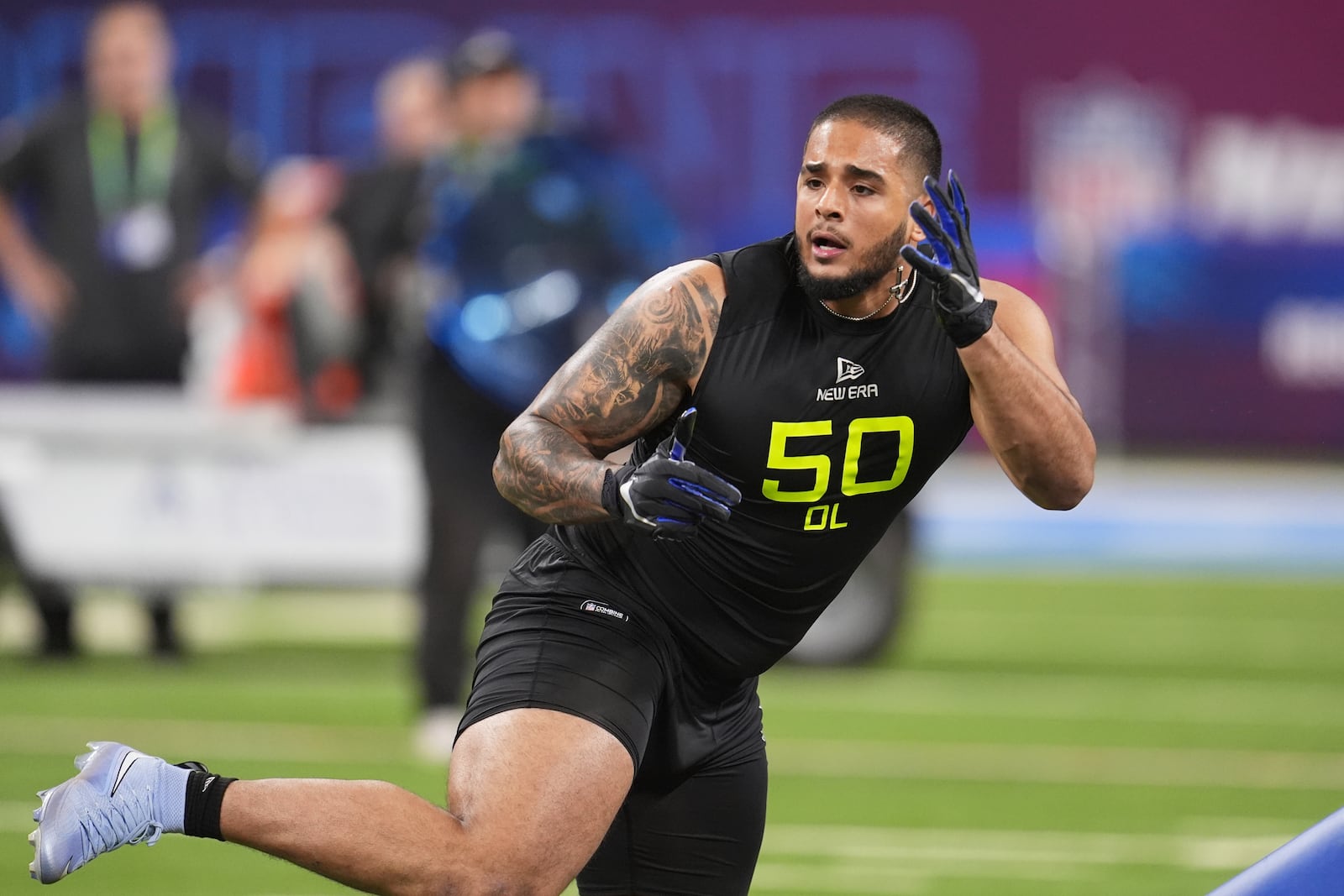 FILE - Boise State defensive lineman Ahmed Hassanein runs a drill at the NFL football scouting combine on Feb. 27, 2025, in Indianapolis. (AP Photo/Michael Conroy, File)