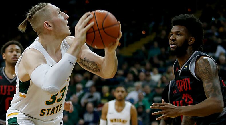 Wright State University center Loudon Love looks to shoot against IUPUI forward Elyjah Goss during their Horizon League game at the Nutter Center in Fairborn Sunday, Feb. 16, 2020. Wright State won 106-66. Contributed photo by E.L. Hubbard