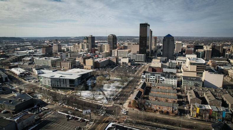 A drone photograph of Dayton looking west. The foreground street is North Patterson Blvd. and the cross street in East Second. Cooper Park is at the intersection. JIM NOELKER/STAFF