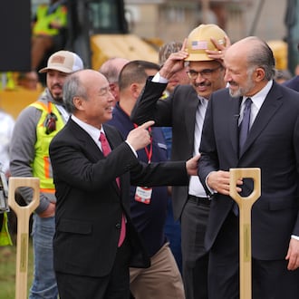 Masayoshi Son, Chairman and CEO of SoftBank Group Corp., left, and Howard Lutnick, Secretary of Commerce speak at a groundbreaking for a new data center Friday, March 20, 2026, in Piketon, Ohio. (AP Photo/Joshua A. Bickel)