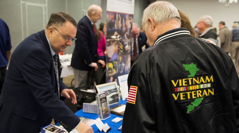 Art Powell, a volunteer with the National Museum of the U.S. Air Force, talks with a retiree and veteran about what the museum has to offer and potential volunteer opportunities during the Wright-Patterson Air Force Base retiree appreciation day event at the Hope Hotel in Dayton, Ohio, Oct. 27, 2017. The event also included several guest speakers from around the base, the Department of Veterans Affairs, and the Ohio Attorney General’s Office. (U.S. Air Force photo/Wesley Farnsworth)