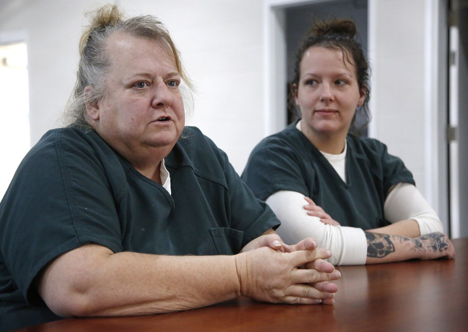 Shellie Werling, 52, of Dayton, left, has overdosed three times. She and Codie Rickman, 29, right , of Miiamisburg spoke about the programs available through the Montgomery County Common Pleas Court Adult Probation Day Reporting facility. “This is my last chance,” Werling said. TY GREENLEES / STAFF